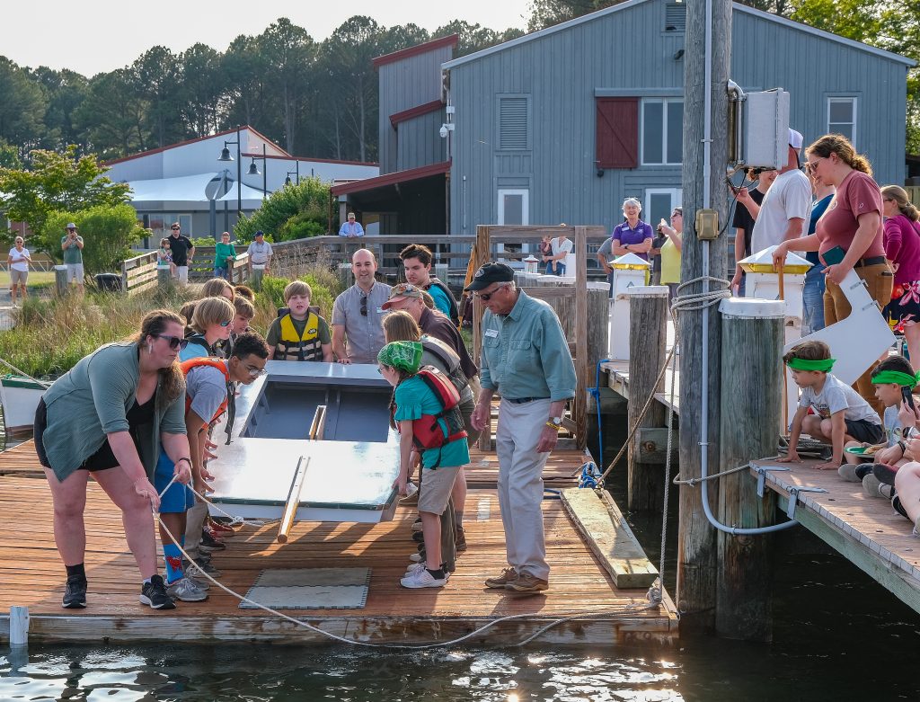 The middle school students in the Chesapeake Bay Maritime Museum’s Rising Tide after-school program launched their newly constructed St. Michaels sailing scow on Monday evening.